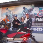 Larry and Ron Kern of A&C handing over the keys to Janet and Nick Keller.