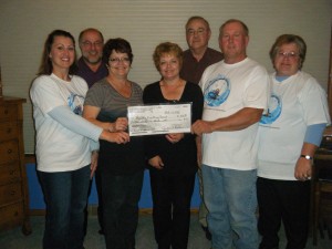 In the photo left to right are Julie Keller Dornbusch, Gary Ashfeld, Janie Martz, Jeanie Thompson, Dennis Weimerskirch, Nick Keller, and Janet Keller. KFCF members not in photo are Paul Jeddeloh, Melissa (Keller) Ngeno, and Carrie Burhop Keller.